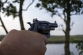 Pistol in Hand. Men's Hands Shoot From a Pistol. A Man Presses his Finger on the Trigger of a Gun Royalty Free Stock Photo