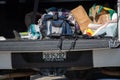 A pistol a magazine and a shotgun sit on the tailgate of a suspects truck during a search of a vehicle by the City of Ventura PD