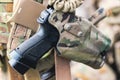 A pistol protruding from a soldiers holster