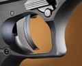 Pistol trigger on a beige background Royalty Free Stock Photo