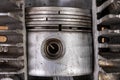 Piston of an internal combustion engine in a cut aluminum cylinder. Internal view of the internal combustion engine