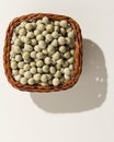 Pea. Wicker basket with grains. Top view, hard light. Royalty Free Stock Photo