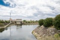 Pit and Drainage Pumping Station with cloudy sky background. Royalty Free Stock Photo