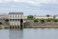 Pit and Drainage Pumping Station with cloudy sky background. Royalty Free Stock Photo