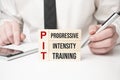 PIT, Progressive Intensity Training symbol. Concept words TSA, tax sheltered annuary on wooden blocks. Beautiful white background