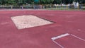 A pit with sand for long jumps has been built at the stadium. A wooden board was laid as a line of push off before the jump. The s