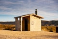 Pit Toilet in Desert Picnic Area Royalty Free Stock Photo