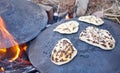 Pita bread baking on a Saj or Tava Royalty Free Stock Photo
