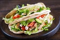 Pita bread sandwiches with grilled chicken meat, avocado, tomato, cucumber Royalty Free Stock Photo