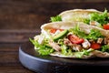 Pita bread sandwiches with grilled chicken meat, avocado, tomato, cucumber Royalty Free Stock Photo