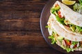 Pita bread sandwiches with grilled chicken meat, avocado, tomato, cucumber Royalty Free Stock Photo