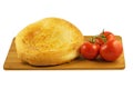 Pita bread and tomatoes on wooden board isolated on white background Royalty Free Stock Photo