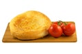 Pita bread and tomatoes on wooden board isolated on white background Royalty Free Stock Photo