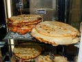 Pita with ham, cheese and salami display at the market. Italian street food Royalty Free Stock Photo