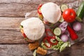 Pita with roasted chicken and vegetables close-up on the table. Royalty Free Stock Photo