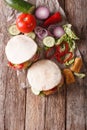 Pita with roasted chicken and vegetables close-up on the table. Royalty Free Stock Photo