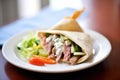 pita sandwich stuffed with gyro meat and tzatziki sauce Royalty Free Stock Photo