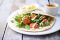 pita wrap with falafel balls and drizzled tahini Royalty Free Stock Photo