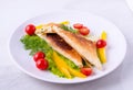 Pita wrapped in a triangle of pita bread on a plate on a white background, with cottage cheese, greens, tomatoes, breakfast and Royalty Free Stock Photo