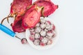 Pitahaya crafted in balls on white background. Sliced tropical fruit. Dessert serving. Carved fruit. Dragon fruit balls. Bright Royalty Free Stock Photo