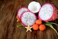 Pitahaya slices, papaya balls and a half of coconut Royalty Free Stock Photo