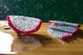a splash of water drips into the pitaya Royalty Free Stock Photo