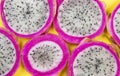 Pitayas/Dragonfruits halves over yellow background Royalty Free Stock Photo