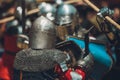 Pitch battle of medieval knights, using metal armor, axes, swords and shields to defend themselves Royalty Free Stock Photo