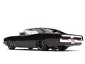 Pitch black American vintage muscle car - rear side view
