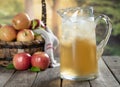 Pitcher of Cold Apple Juice and Fresh Apples Royalty Free Stock Photo