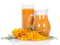 Pitcher, glass juice from berries sea buckthorn isolated on white.