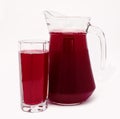 Pitcher and glass of red fruit juice isolated Royalty Free Stock Photo