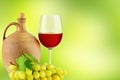 Pitcher with grape wine, glass and bunch grapes Royalty Free Stock Photo