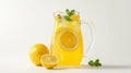 Pitcher of lemonade with lemon slices and mint on a white background, with whole and halved lemons Royalty Free Stock Photo