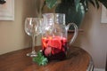A Pitcher of Sangria and Two Wine Glasses on a Table