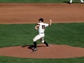 Pitcher steps forward to throw pitch from mound