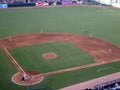 Pitcher throws pitch to batter who waits on throw with ball in a Royalty Free Stock Photo