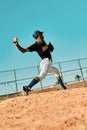 Pitchers are often the best all-around athletes on the team. Shot of a young baseball player pitching the ball during a Royalty Free Stock Photo