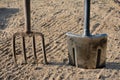 Pitchfork and spade stuck in the ground. Royalty Free Stock Photo