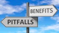 Pitfalls and benefits as a choice - pictured as words Pitfalls, benefits on road signs to show that when a person makes decision