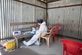 Pithoragarh, India, May, 2021 : A frontline worker in PPE KIT keeping track of RTPCR tests performed