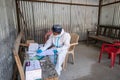 Pithoragarh, India, May, 2021 : A frontline worker in PPE KIT keeping track of RTPCR tests performed