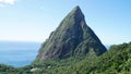 The Piton mountains Gros Piton and Petit Piton in a lush green forest next to the blue ocean on Saint Lucia Island in the Caribbea