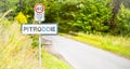 Pitroddie village sign on countryside road in central Scotland. 40 miles speed limit sign