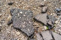 Pits on the road and destroyed asphalt. Background with copy space Royalty Free Stock Photo