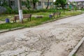 Pits on the road and destroyed asphalt. Background with copy space Royalty Free Stock Photo