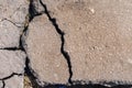 Pits on the road and destroyed asphalt. Background with copy space Royalty Free Stock Photo