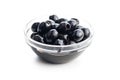 Pitted black olives in bowl isolated on white background Royalty Free Stock Photo