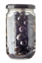 Pitted black olives in glass jar Royalty Free Stock Photo