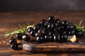 pitted black olives on wooden board Royalty Free Stock Photo